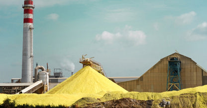 Industrial size stockpiles of Sulphur.